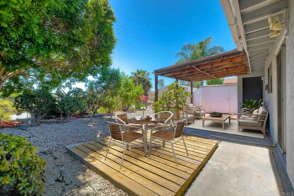 4549 Quailridge Drive Oceanside, CA 92056 - Photo 4 of 25 a view of a patio with couches and table and chairs and potted plants