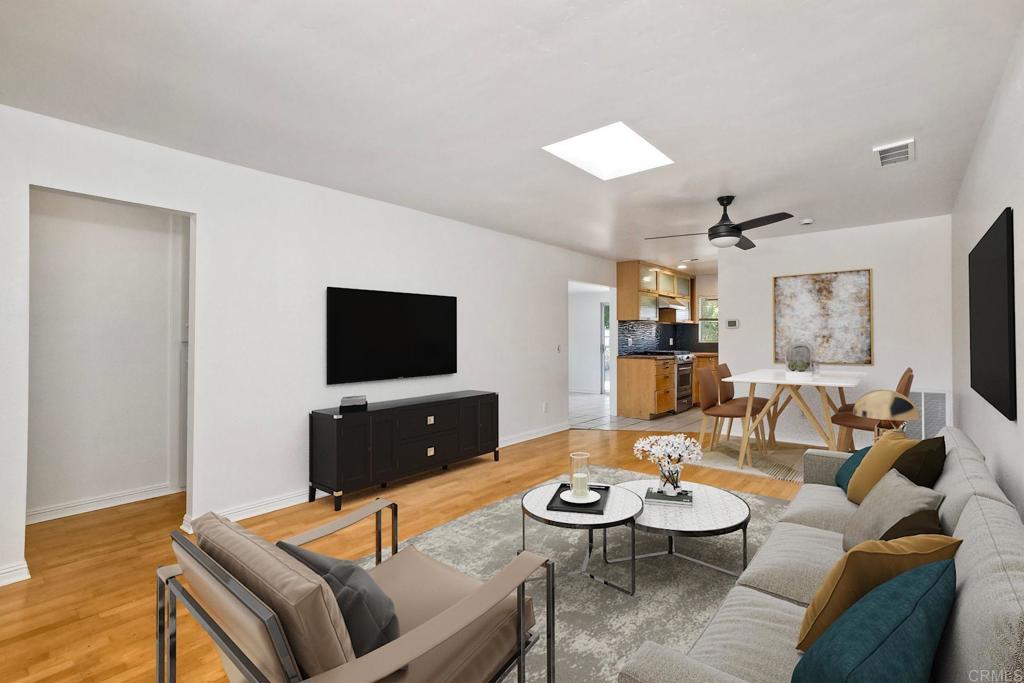 4549 Quailridge Drive Oceanside, CA 92056 - Photo 5 of 25 a living room with furniture and a flat screen tv