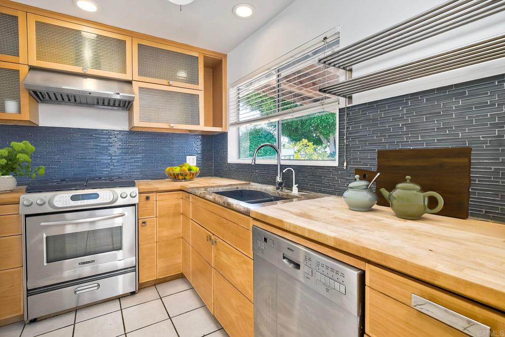 4549 Quailridge Drive Oceanside, CA 92056 - Photo 8 of 25 a kitchen with a sink and cabinets