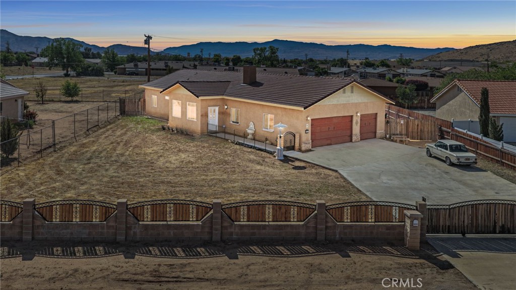 a aerial view of a house with a yard