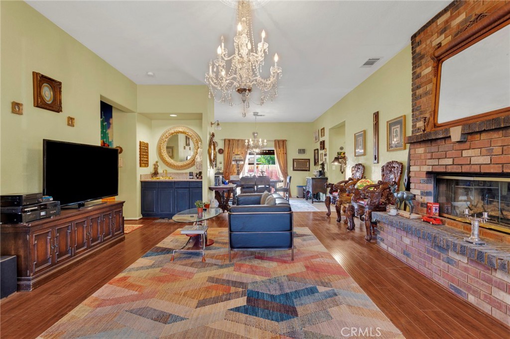 20151 Serrano Road Apple Valley, CA 92307 - Photo 12 of 59 a living room with furniture and a flat screen tv