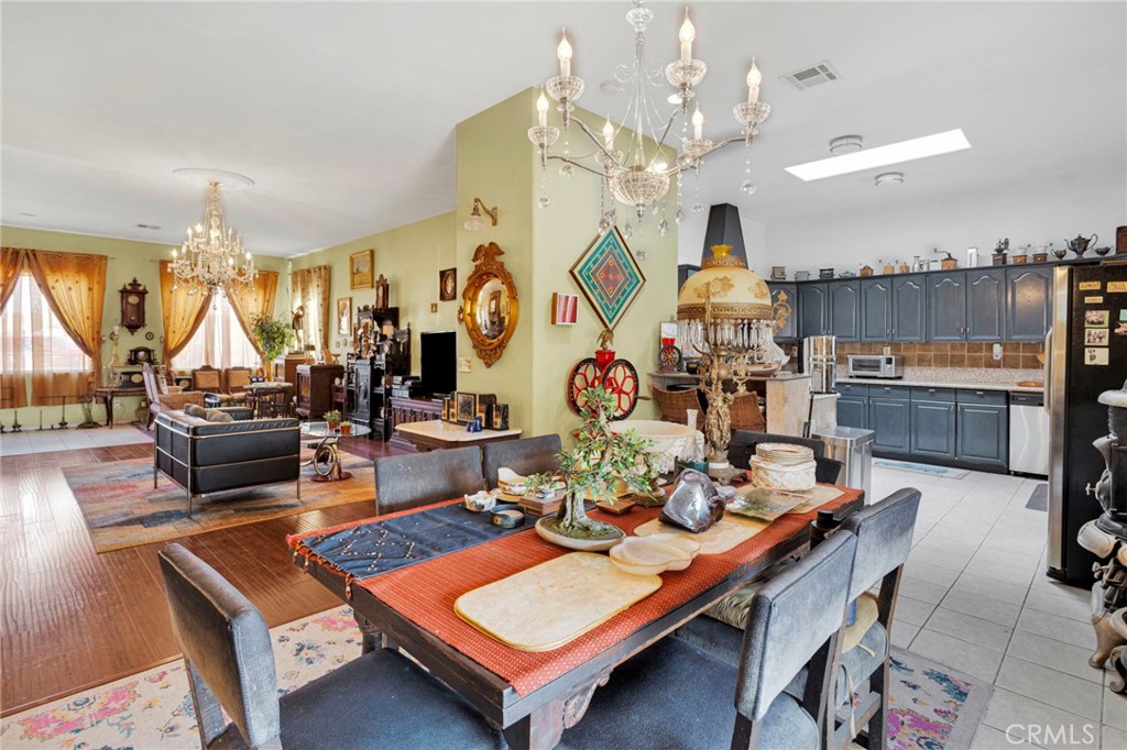 20151 Serrano Road Apple Valley, CA 92307 - Photo 16 of 59 a living room with furniture and a chandelier