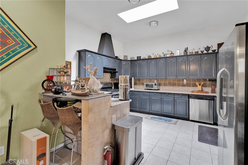 20151 Serrano Road Apple Valley, CA 92307 - Photo 17 of 59 a kitchen with a sink and cabinets
