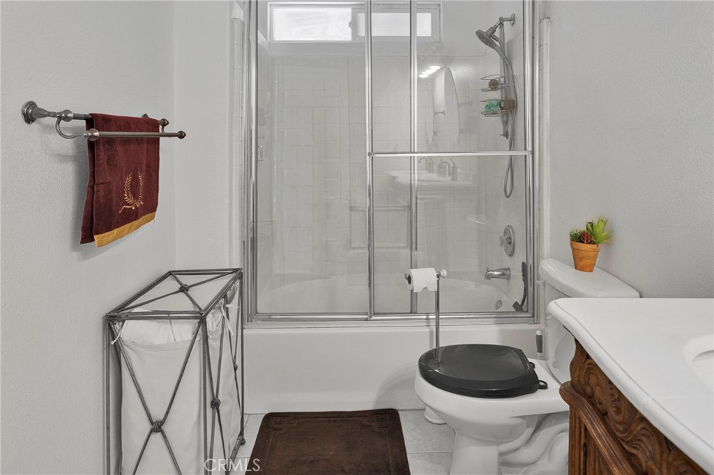 20151 Serrano Road Apple Valley, CA 92307 - Photo 29 of 59 a bathroom with a sink a toilet and shower