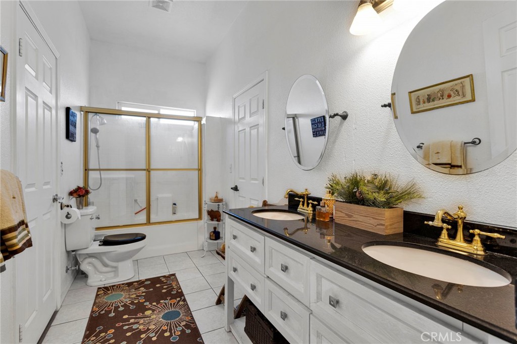 20151 Serrano Road Apple Valley, CA 92307 - Photo 32 of 59 a spacious bathroom with a double vanity sink mirror and bathtub