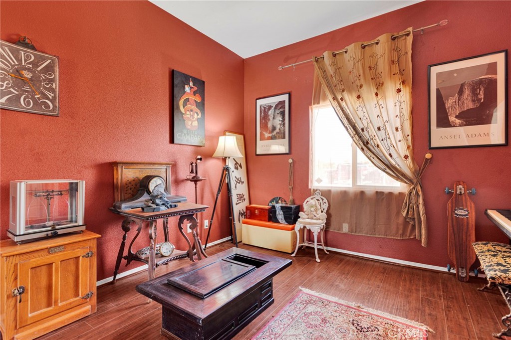 20151 Serrano Road Apple Valley, CA 92307 - Photo 33 of 59 a living room with furniture a rug and a window