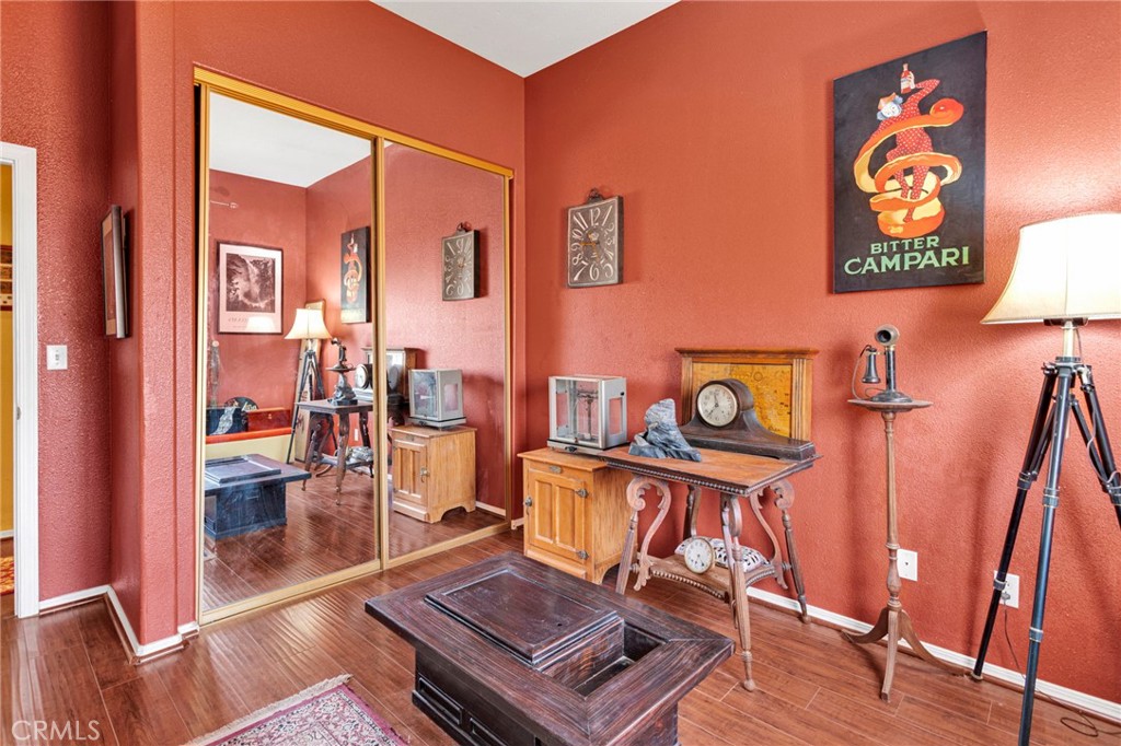 20151 Serrano Road Apple Valley, CA 92307 - Photo 34 of 59 a living room with furniture and a wooden floor