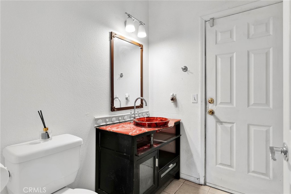 20151 Serrano Road Apple Valley, CA 92307 - Photo 39 of 59 a bathroom with a sink and a mirror