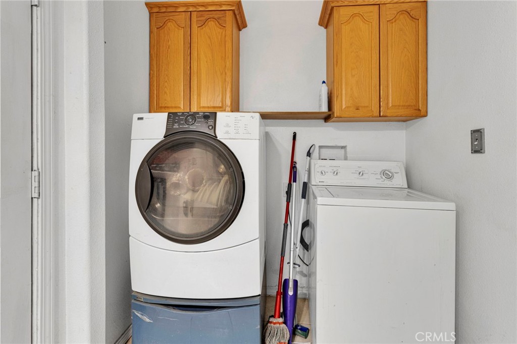 20151 Serrano Road Apple Valley, CA 92307 - Photo 40 of 59 a utility room with dryer and washer