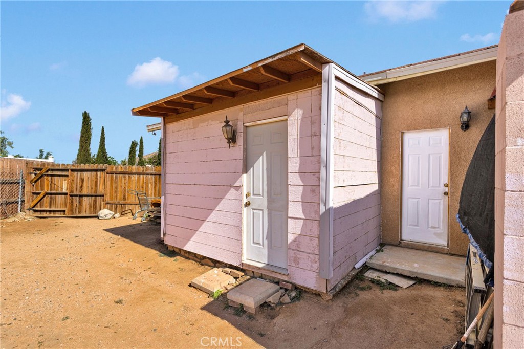 20151 Serrano Road Apple Valley, CA 92307 - Photo 46 of 59 a view of a house with a backyard