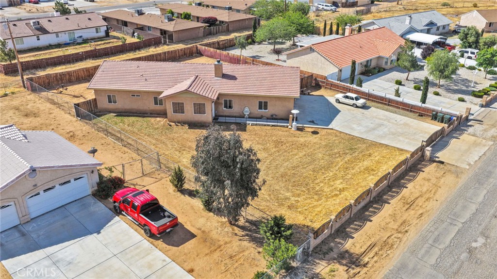 20151 Serrano Road Apple Valley, CA 92307 - Photo 48 of 59 an aerial view of a house with a yard