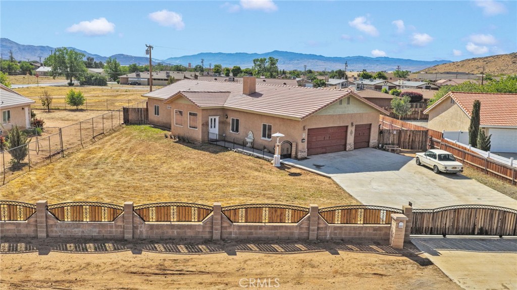 20151 Serrano Road Apple Valley, CA 92307 - Photo 51 of 59 a view of a house with a swimming pool