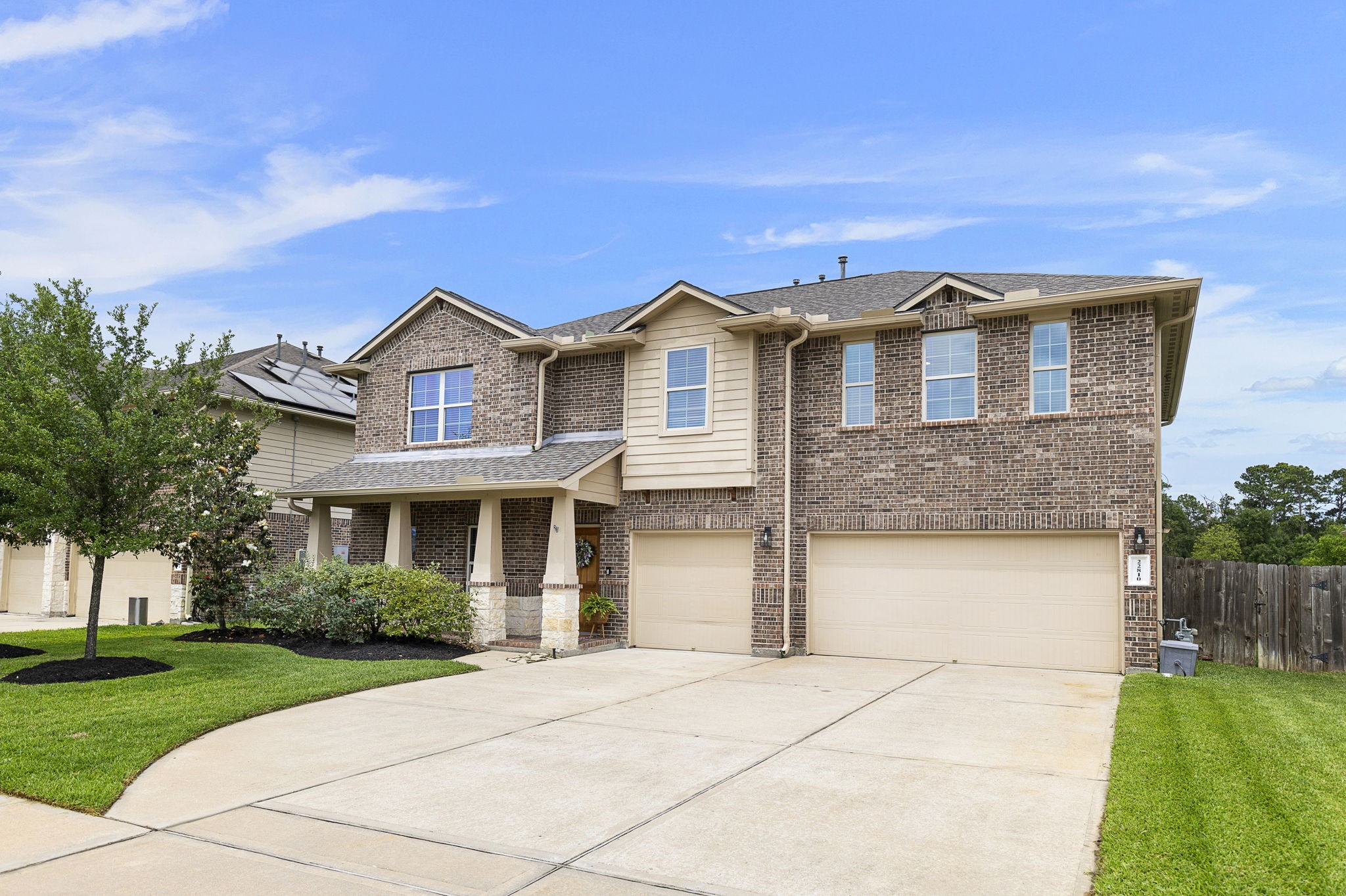 22810 Dale River Road Tomball, TX 77375 - Photo 3 of 44 Extra wide driveway for easy parking in addition to the oversized 3-car garage.