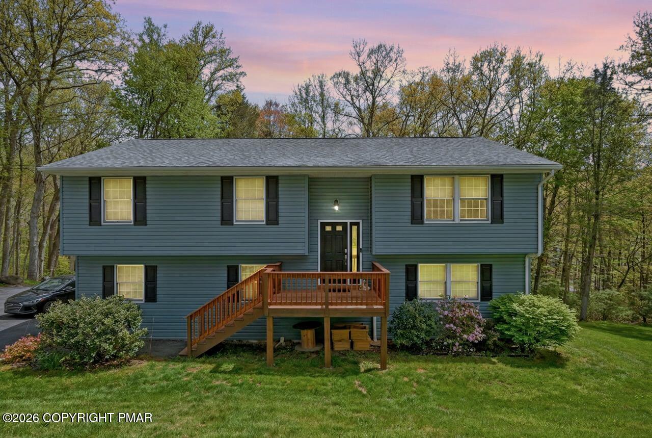 256 Devils Hole Road Cresco, PA 18326 - Photo 2 of 56 a backyard of a house with table and chairs