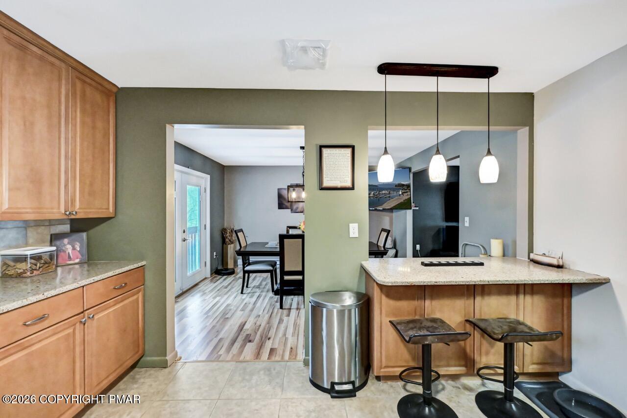 256 Devils Hole Road Cresco, PA 18326 - Photo 25 of 56 a kitchen with a table and chairs in it