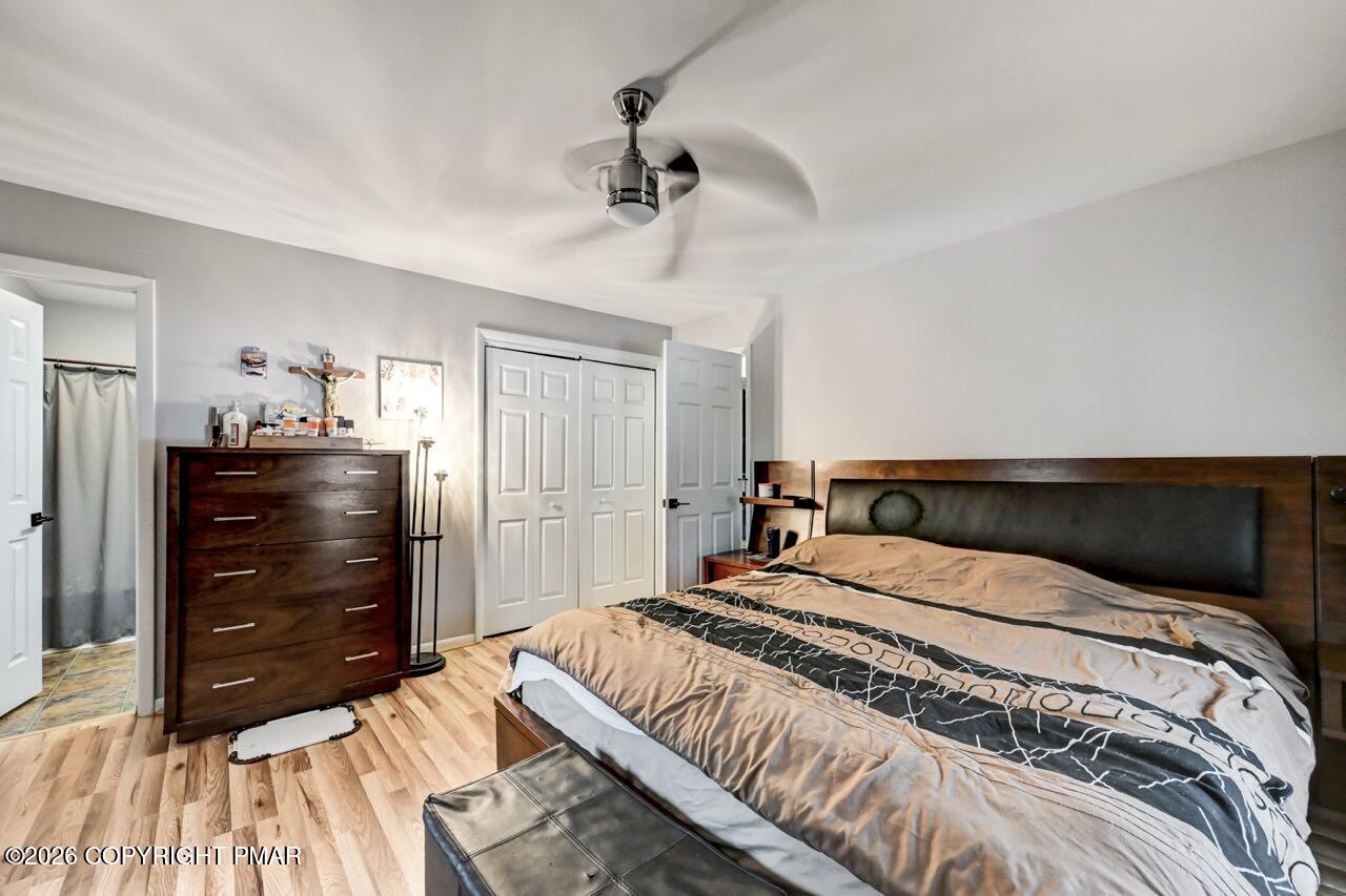 256 Devils Hole Road Cresco, PA 18326 - Photo 30 of 56 a bedroom with a bed and a dresser