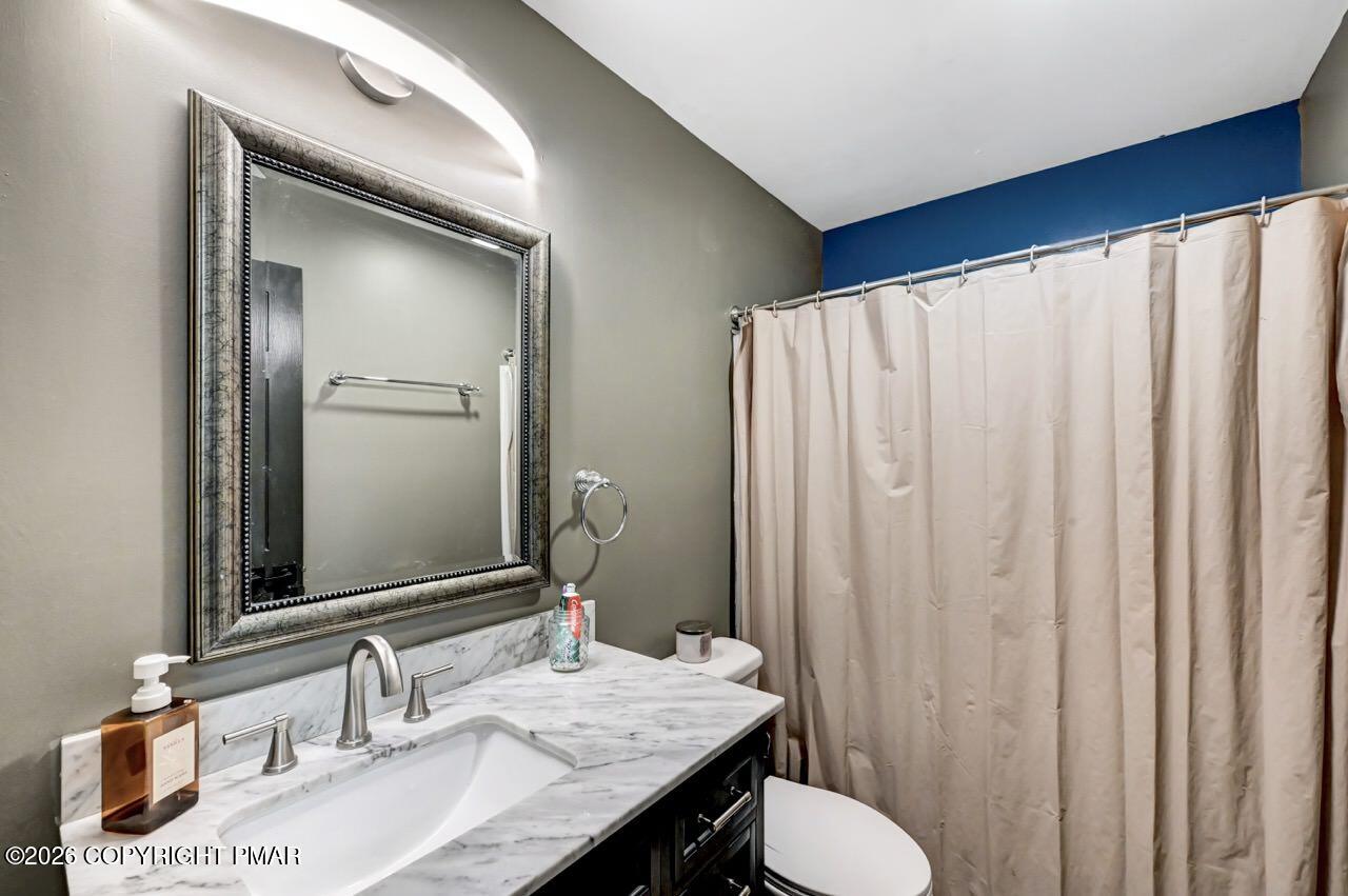256 Devils Hole Road Cresco, PA 18326 - Photo 38 of 56 a bathroom with a granite countertop sink and a mirror
