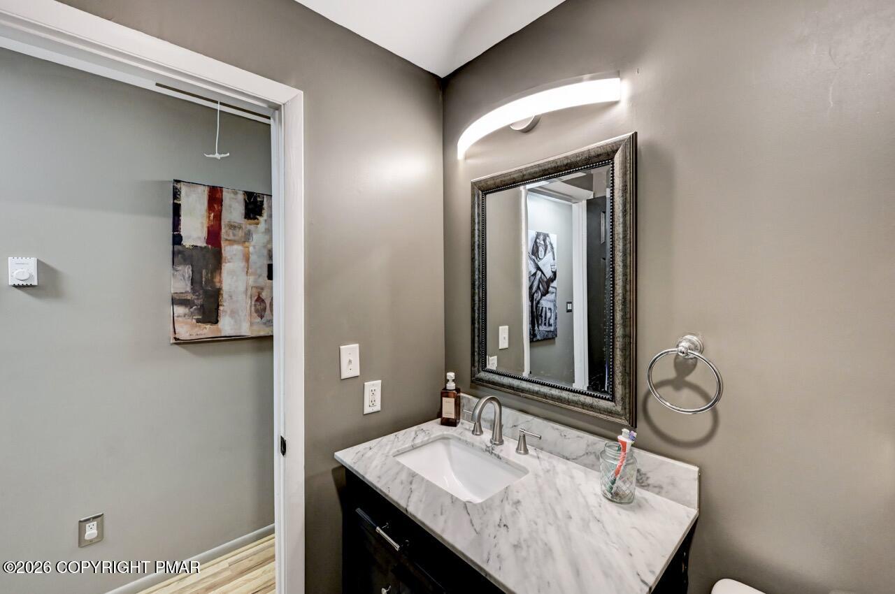 256 Devils Hole Road Cresco, PA 18326 - Photo 39 of 56 a bathroom with a sink vanity and a mirror