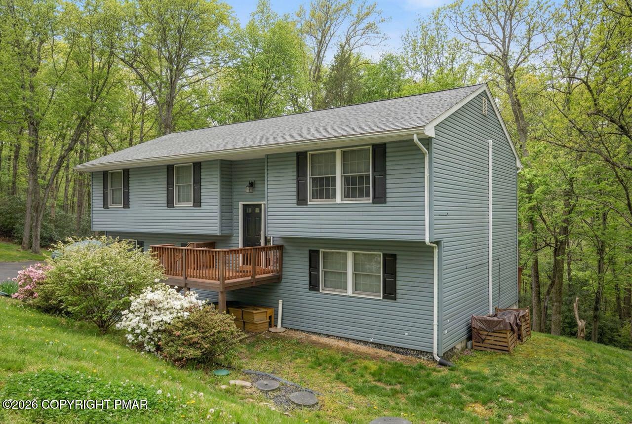 256 Devils Hole Road Cresco, PA 18326 - Photo 4 of 56 a front view of a house with garden