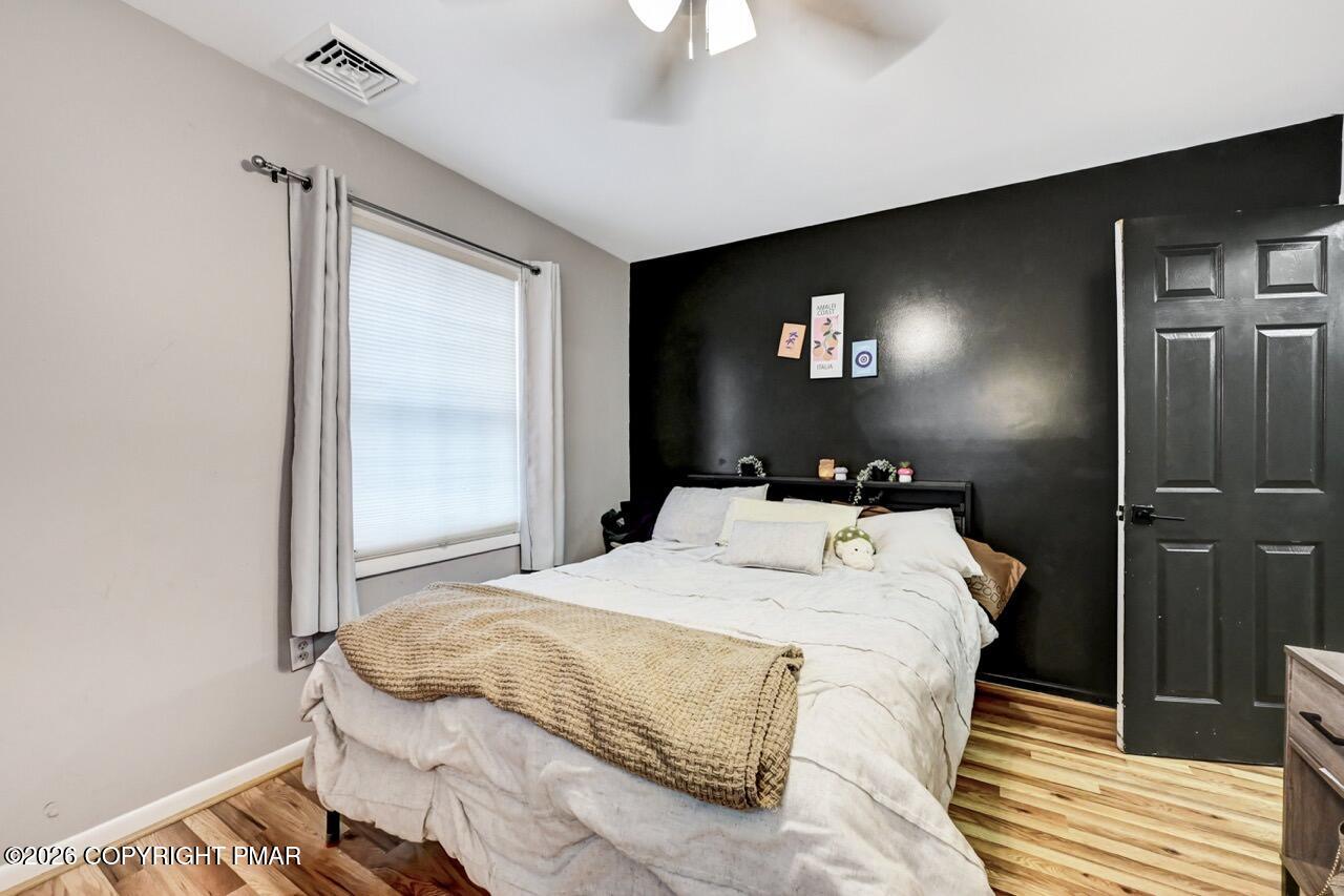 256 Devils Hole Road Cresco, PA 18326 - Photo 41 of 56 a bedroom with a bed and a mirror