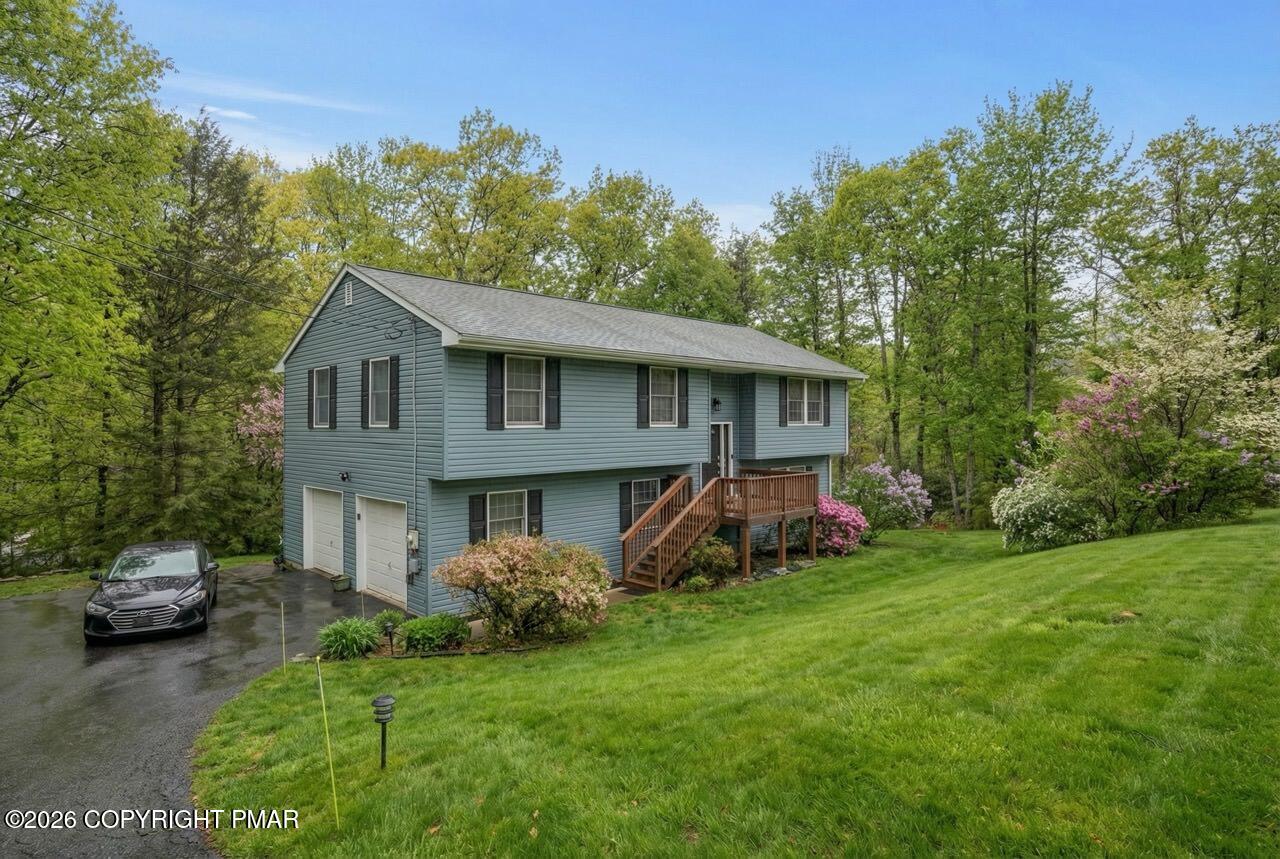 256 Devils Hole Road Cresco, PA 18326 - Photo 5 of 56 a view of a house with a garden