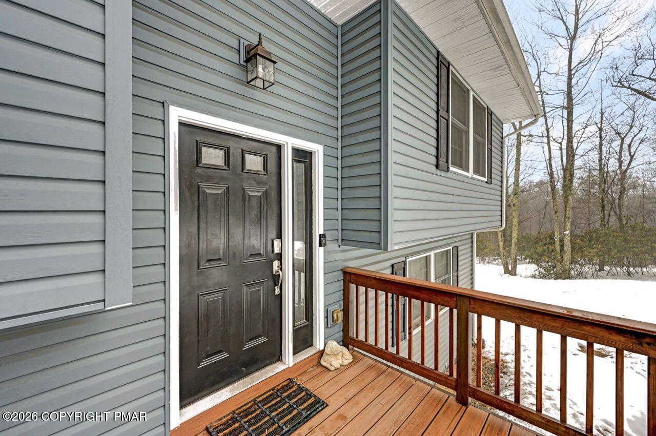 256 Devils Hole Road Cresco, PA 18326 - Photo 6 of 56 a balcony view with a glass door