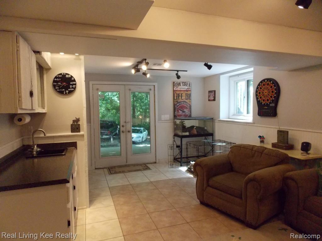 1654 Rochester Road Leonard, MI 48367 - Photo 36 of 45 Lower Family Room with Entry