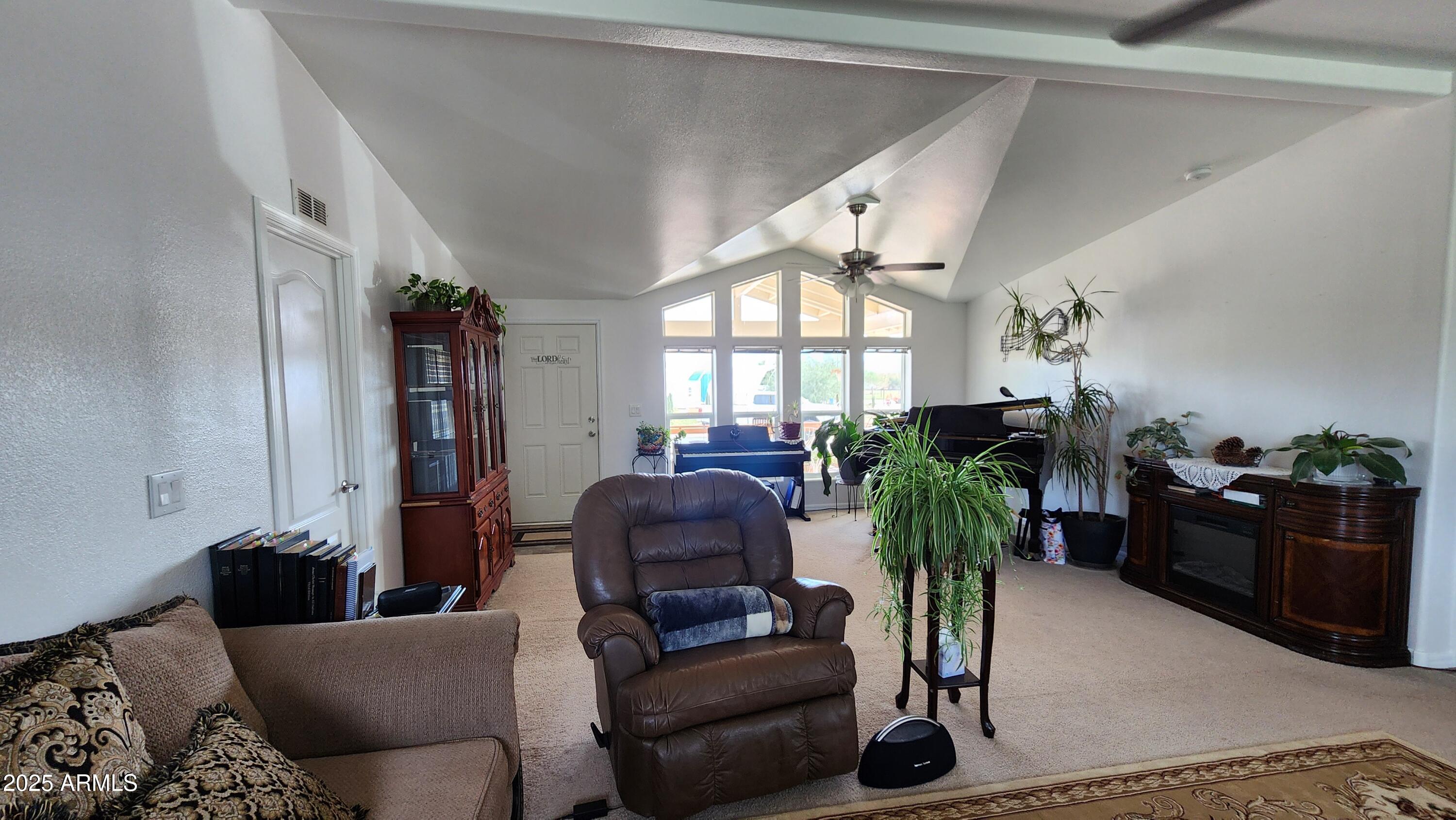 35448 2nd Street Wenden, AZ 85357 - Photo 7 of 74 a living room with furniture flowerpot and a chandelier