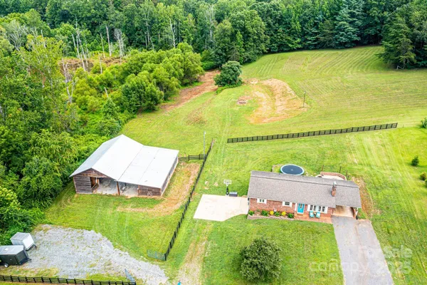 a view of a swimming pool with a yard