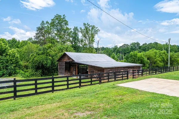 a view of a room with wooden floor and roof
