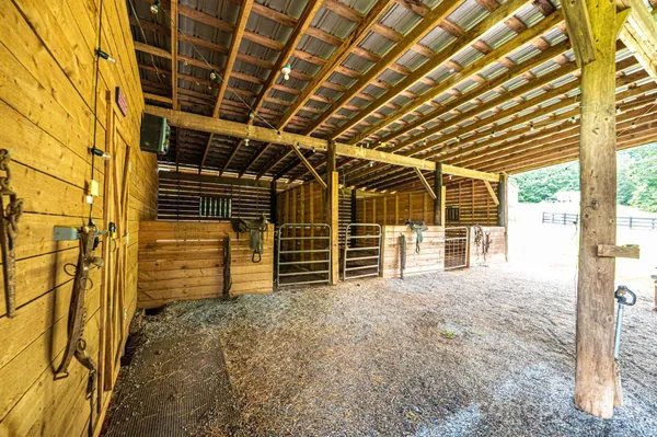 a view of a house with a yard and sitting area