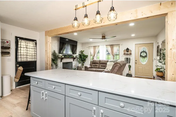 a view of living room with granite countertop furniture and fireplace