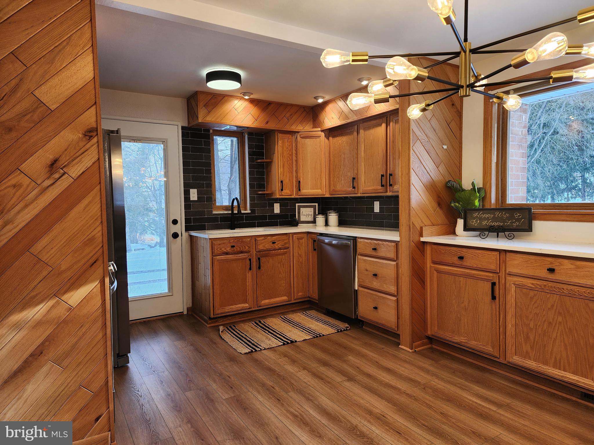 111 South Georgia Street Ridgeley, WV 26753 - Photo 25 of 79 a kitchen with a sink cabinets stainless steel appliances and a window