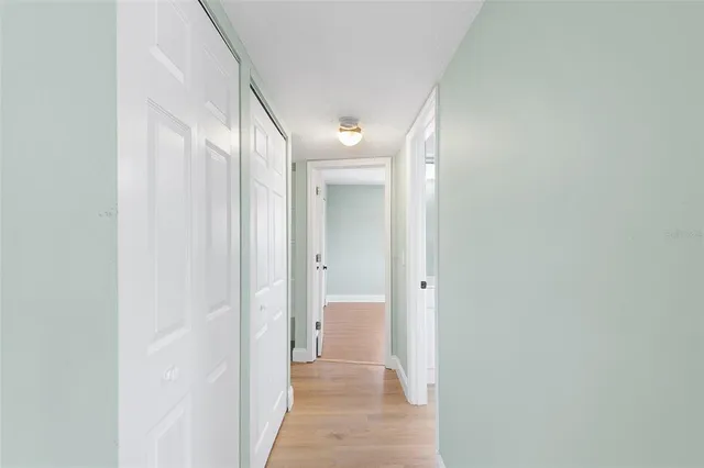 a view of a bathroom from a hallway