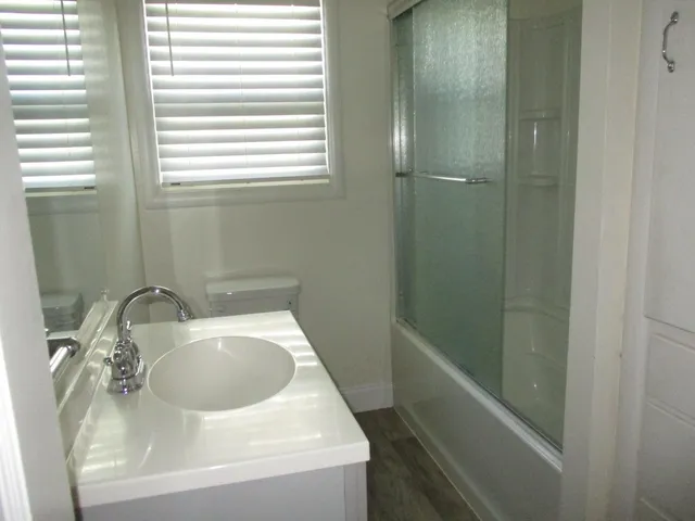 a bathroom with a sink and vanity