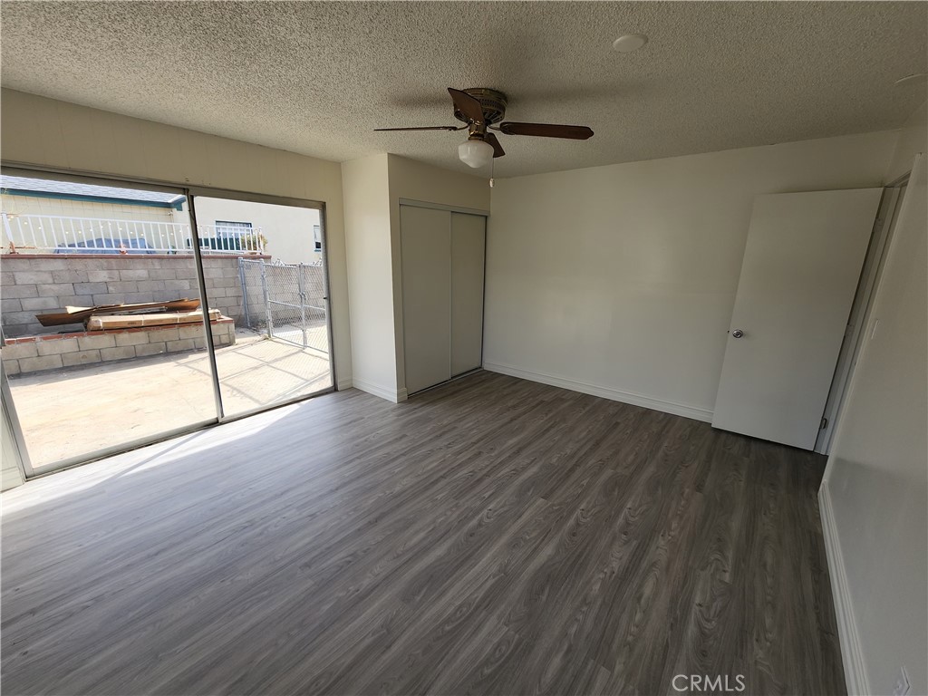 3451 Mono Drive Riverside, CA 92506 - Photo 3 of 14 wooden floor in an empty room with a window