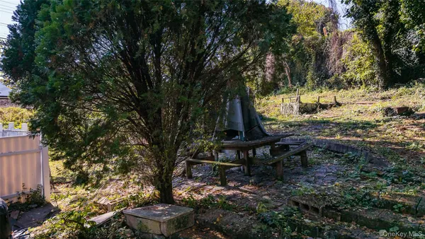 a view of a backyard with sitting area