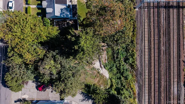 an aerial view of a house with a tree