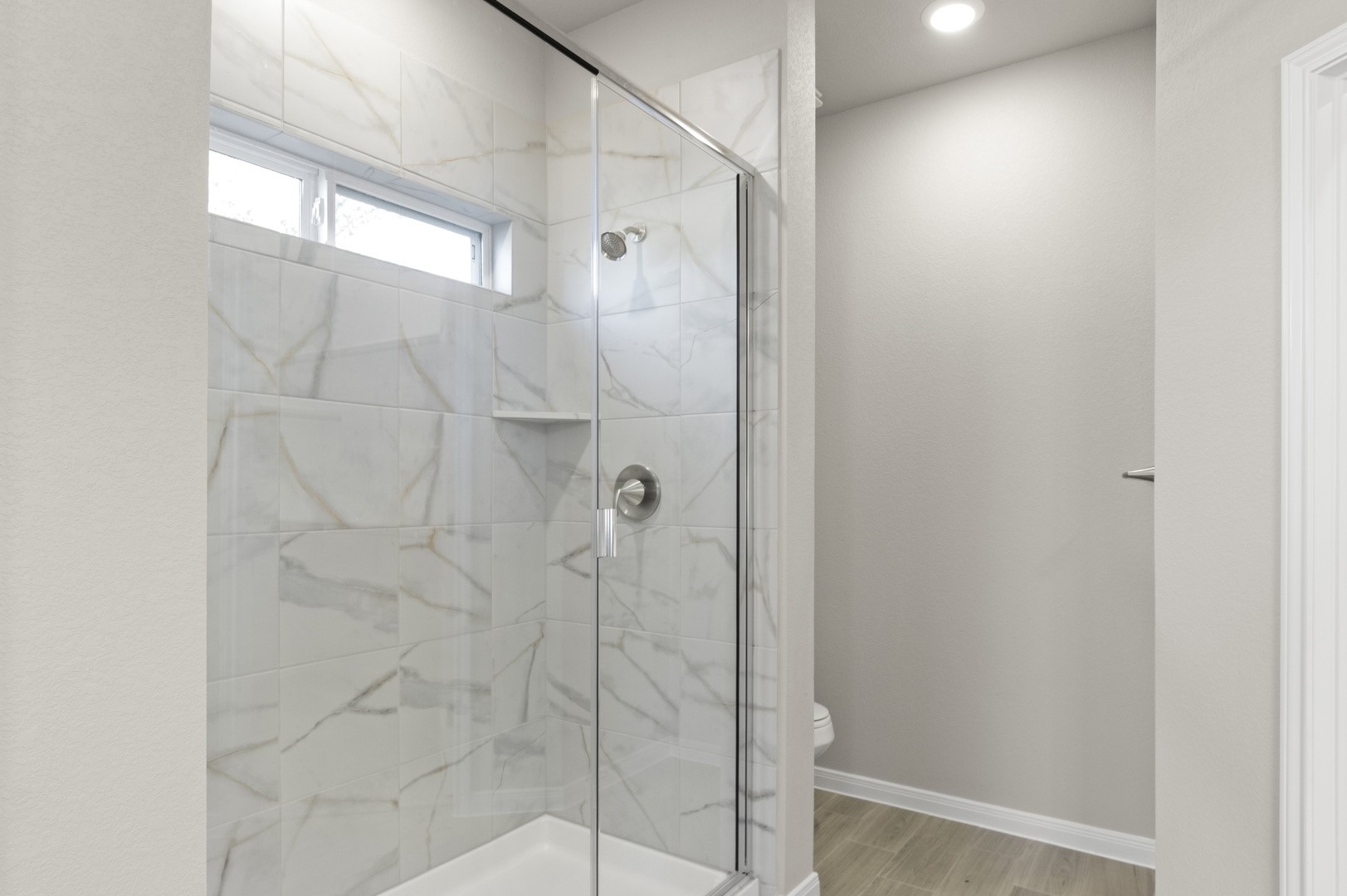 108 Outlaw Drive Jarrell, TX 76537 - Photo 11 of 17 a bathroom with a glass shower door