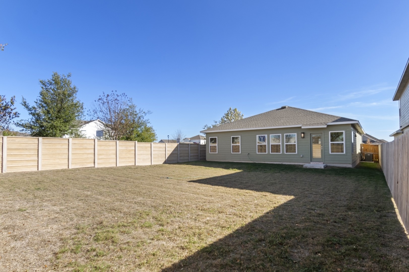 108 Outlaw Drive Jarrell, TX 76537 - Photo 15 of 17 a front view of a house with a yard and garage