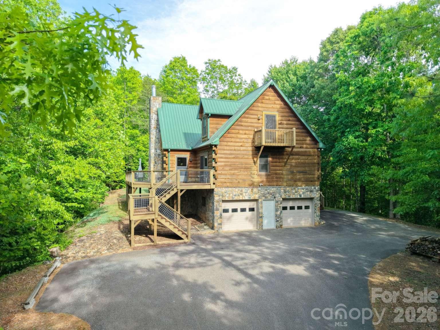 3815 Bat Cave Road Old Fort, NC 28762 - Photo 1 of 45 a view of backyard of house