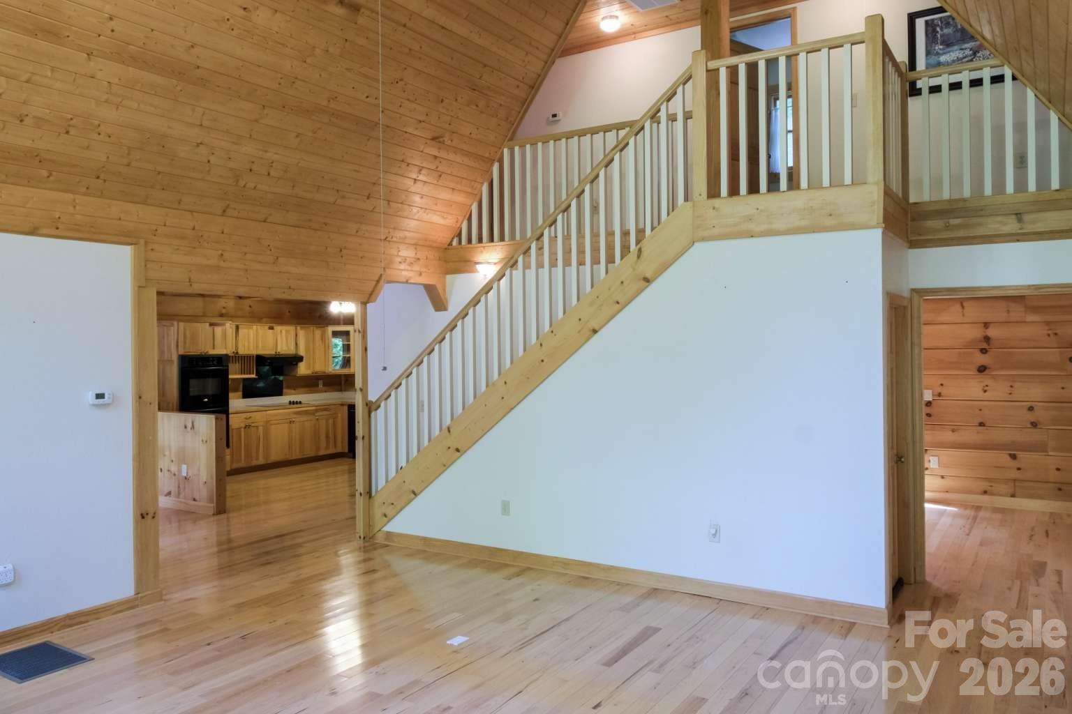 3815 Bat Cave Road Old Fort, NC 28762 - Photo 12 of 45 a view of a hallway with an entryway and wooden floor