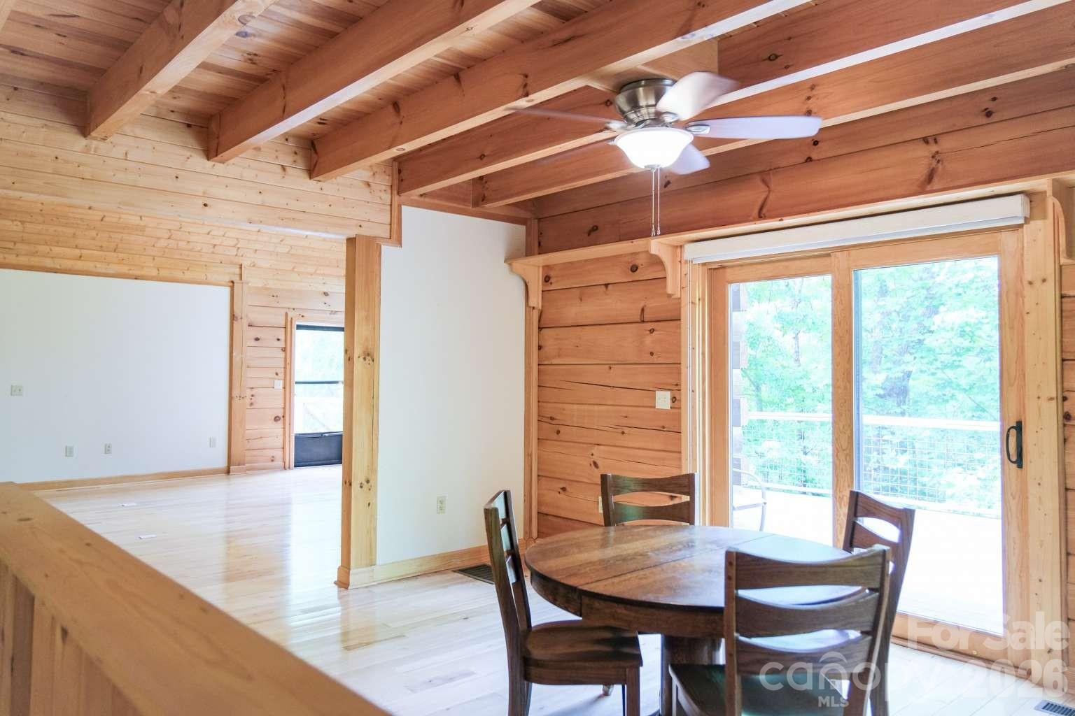3815 Bat Cave Road Old Fort, NC 28762 - Photo 18 of 45 a dining room with furniture and window