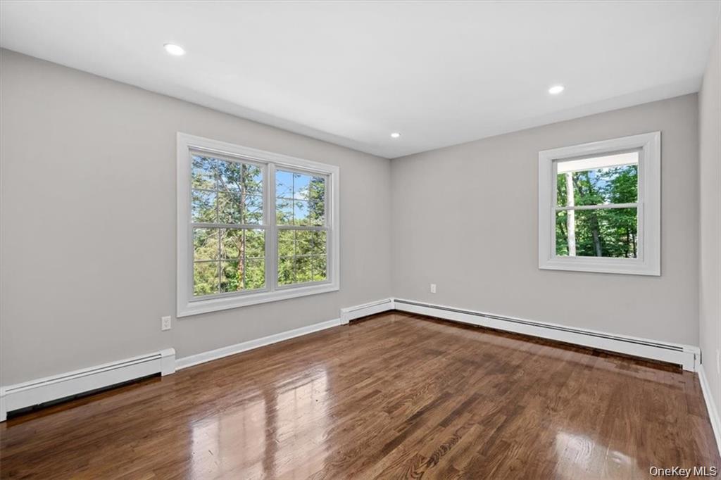 54 Brothers Road Poughquag, NY 12570 - Photo 13 of 18 an empty room with wooden floor and windows