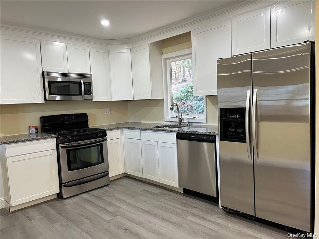 54 Brothers Road Poughquag, NY 12570 - Photo 10 of 18 a kitchen with a refrigerator stove and microwave