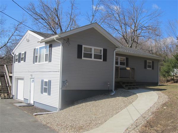 a front view of a house with a garage