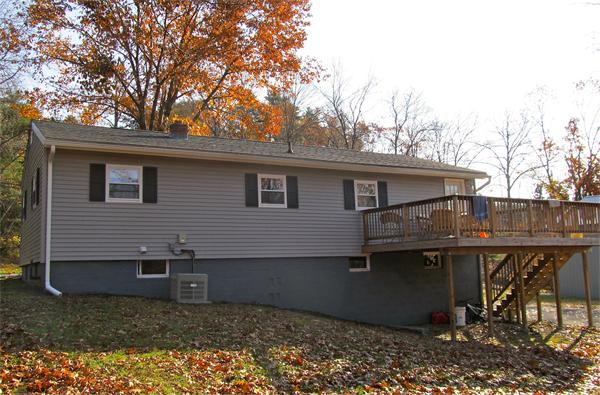 439 Warren Wright Road Belchertown, MA 01007 - Photo 12 of 13 a backyard of a house with wooden deck