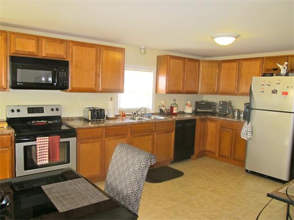 439 Warren Wright Road Belchertown, MA 01007 - Photo 3 of 13 a kitchen with stainless steel appliances granite countertop a refrigerator sink and stove
