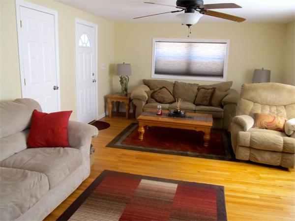 439 Warren Wright Road Belchertown, MA 01007 - Photo 6 of 13 a living room with furniture and a flat screen tv