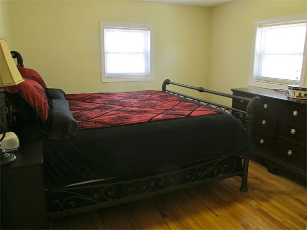 439 Warren Wright Road Belchertown, MA 01007 - Photo 7 of 13 a bedroom with a bed and a window
